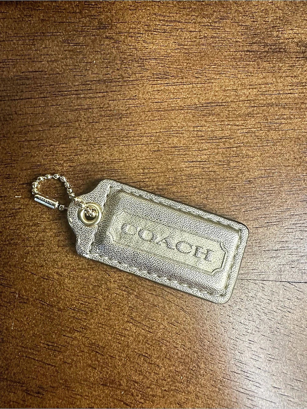 COACH gold metallic hang tag